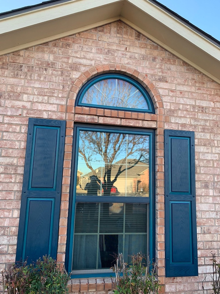 After — Freshly painted window trim and shutters on a Newcastle, OK home