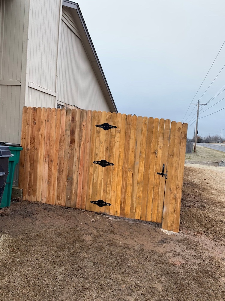After — Newly built cedar fence along the same yard in Newcastle, OK