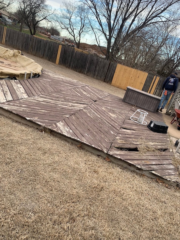 Before — Rotted, failing deck boards on a backyard deck