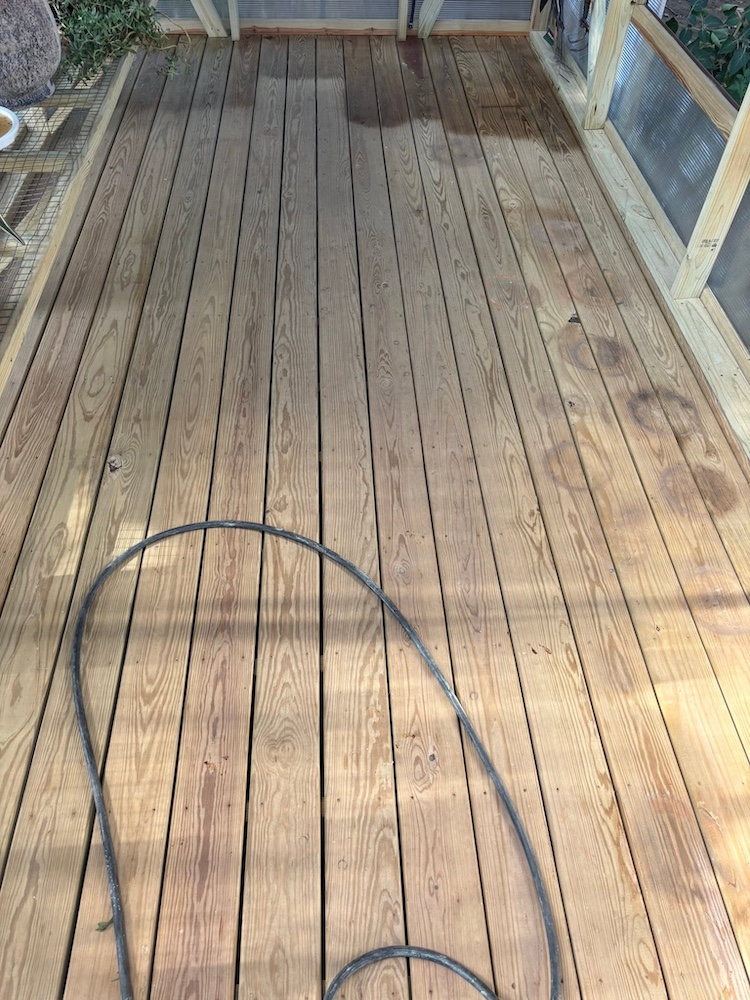 After — Rebuilt deck with new boards and clean finish